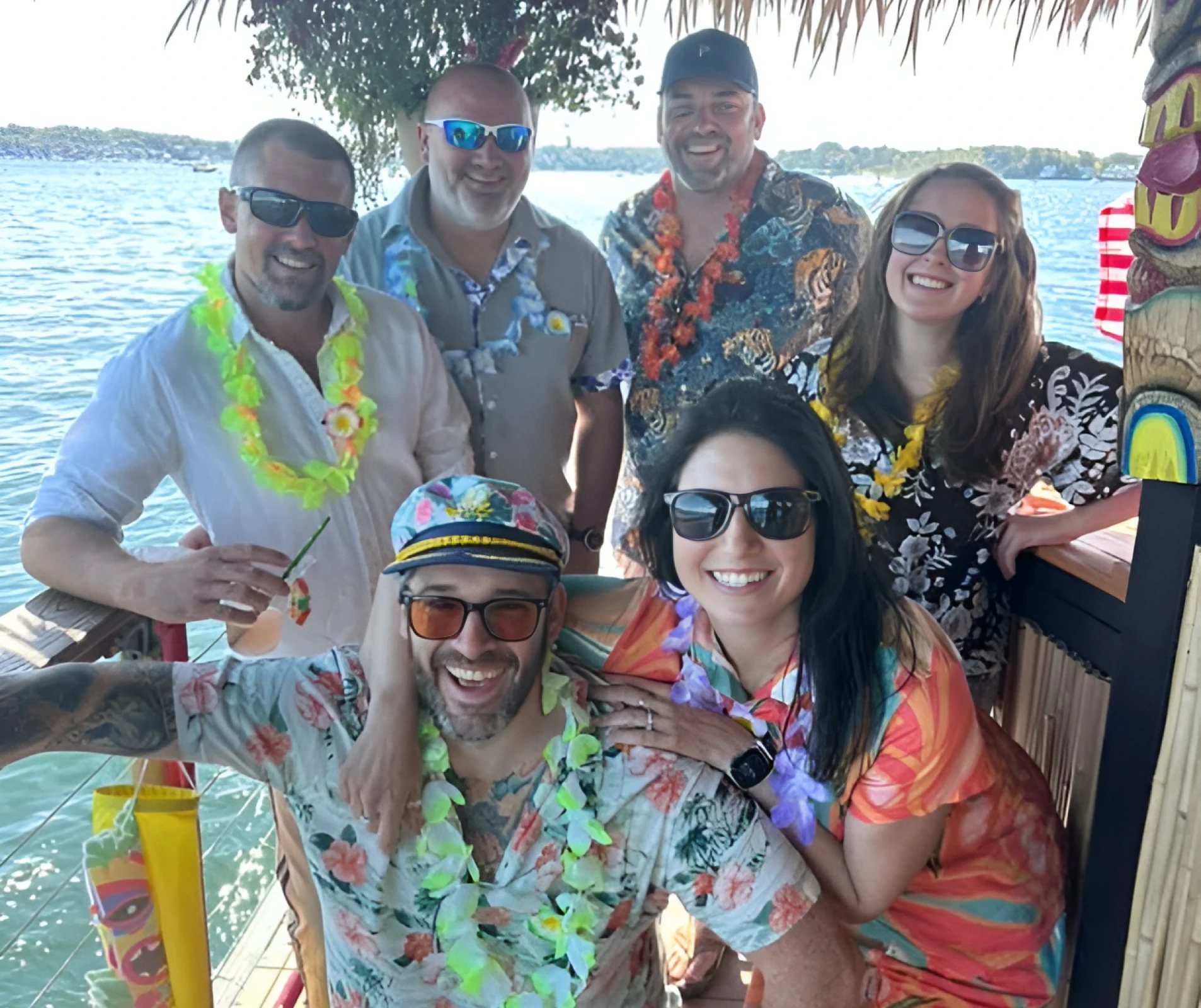 Smiling friends at a lakeside gathering