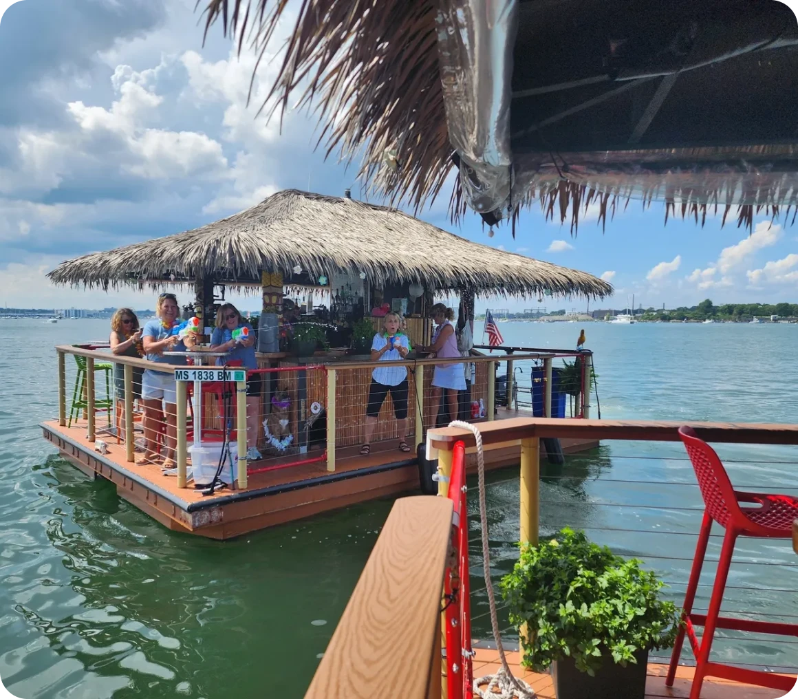 Tropical barboat with passengers on lake