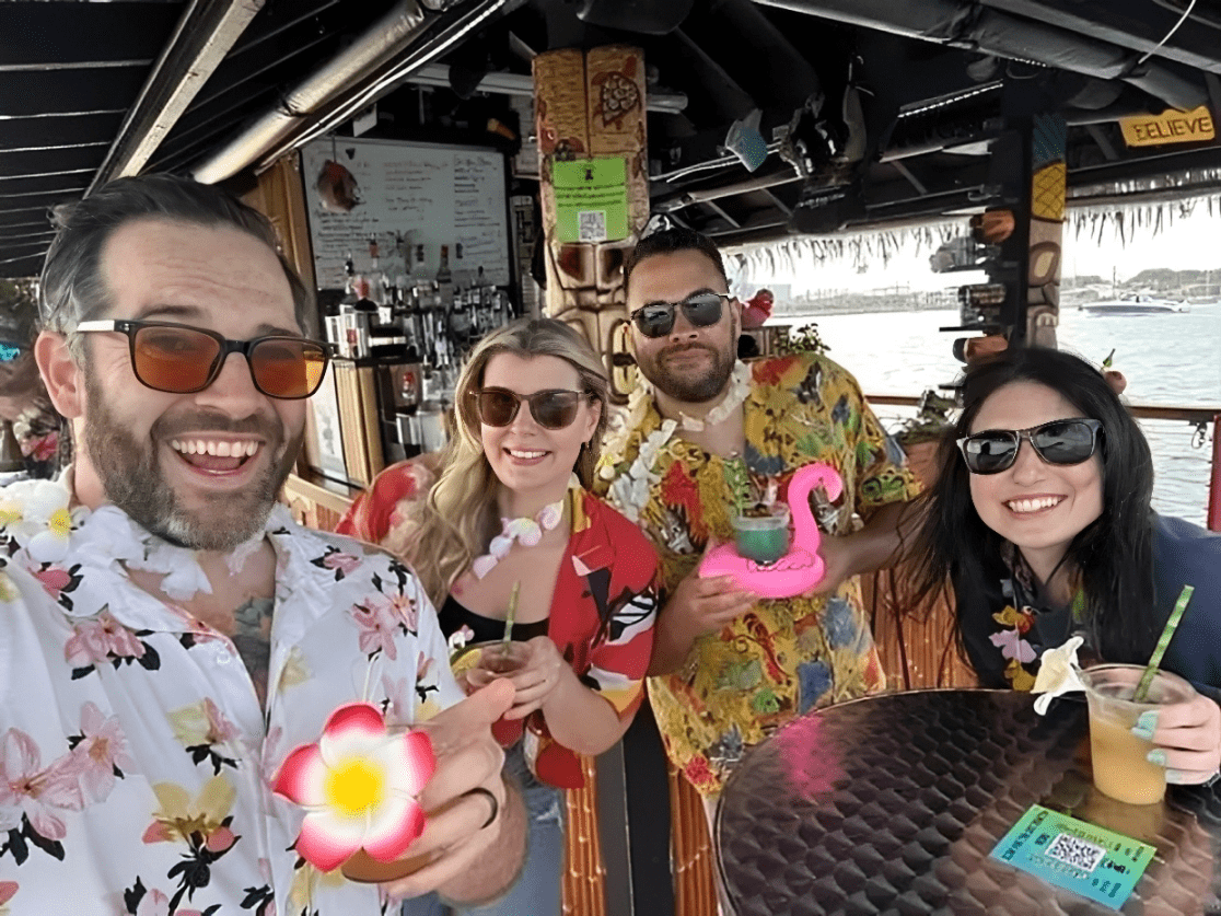 Group in tropical outfits having fun
